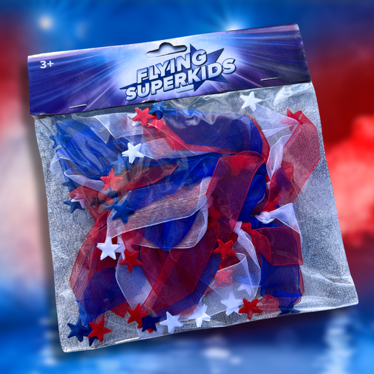 Flying superkids hårpynt i blå og rød. i flying superkids indpakning